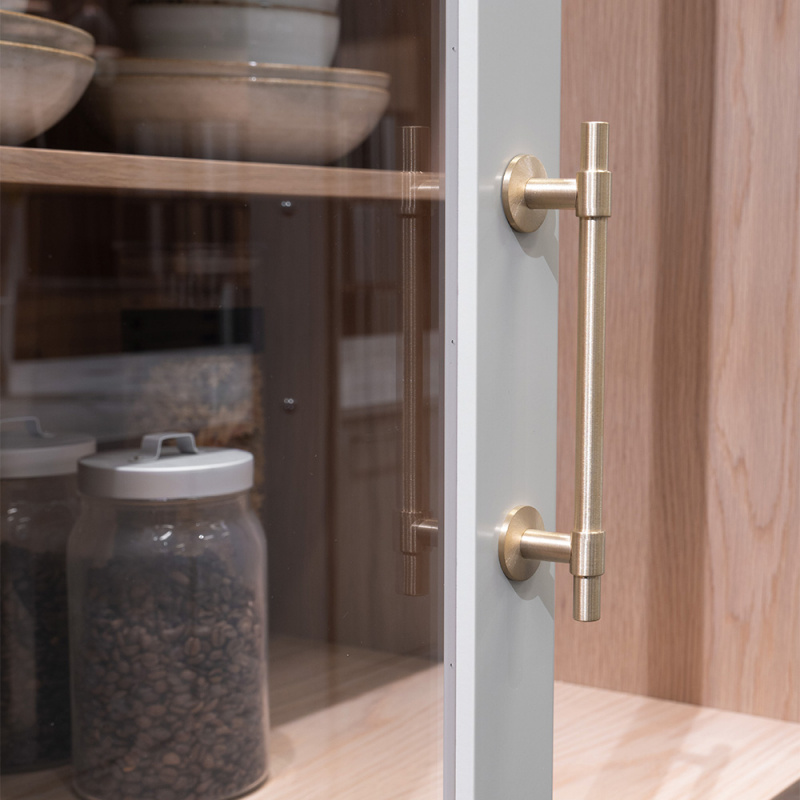 Handtag Uniform - 128mm - Borstad obehandlad mässing